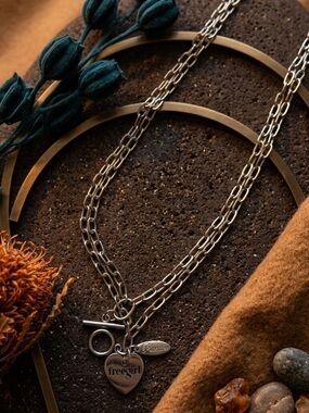 New with Box Plunder “Free Girl” Silver Tone Necklace